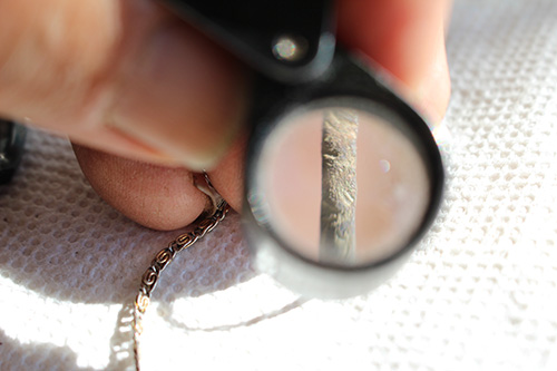 Display of artifiact through magnifying glass