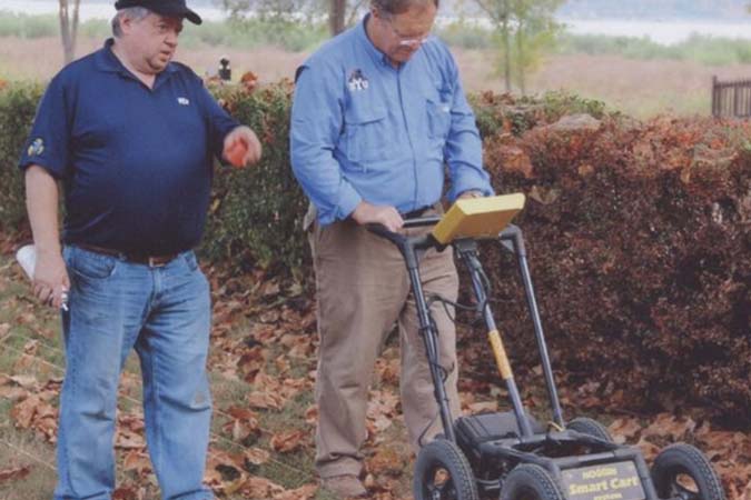 Bob Smith and Bill Keech using ground penetrating radar
